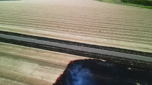Fire on the field in Ukraine. Aerial view of the burning field