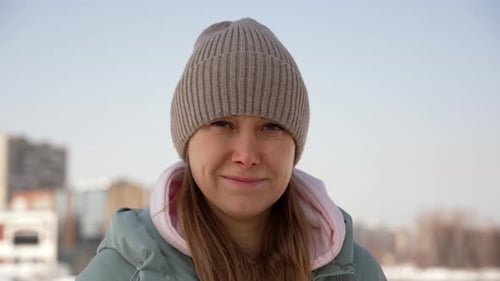Smiling Young Woman Close-Up on a Winter Day
