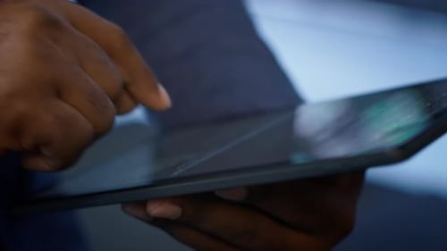 Extreme Close Up Shot of Worker in Server Hub Using Tablet