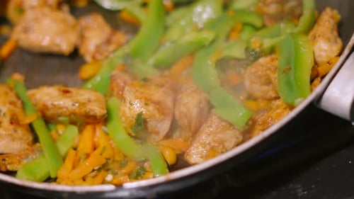 Chicken and Vegetables Stir Fry Cooking Close Up