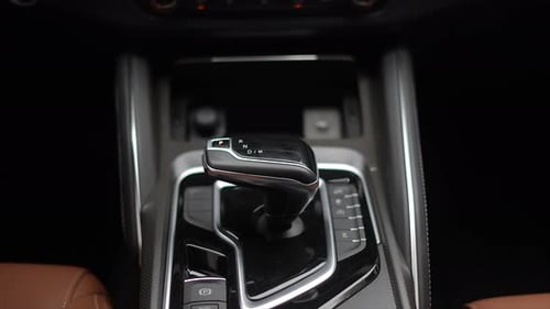 Close Up of Automobile Center Console and Gearshift