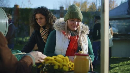 Woman Shopping at Sunny Outdoor Farmers Market