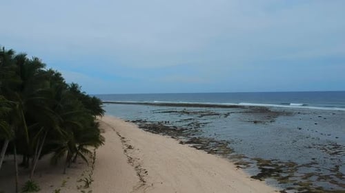 drone footage over Blue Pacifico Beach Siargao