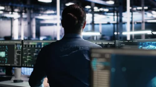 Server Room Software Developer Using AI to Review Infrastructure Diagnostics