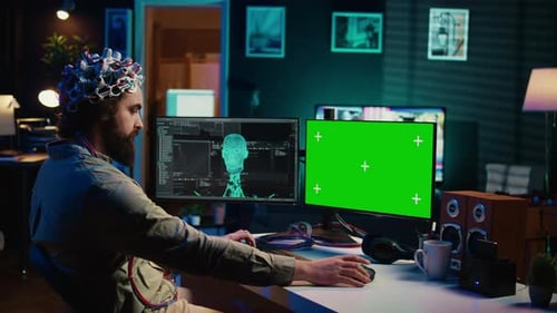 Computer Engineer Starting Mind Upload Process Using Green Screen PC