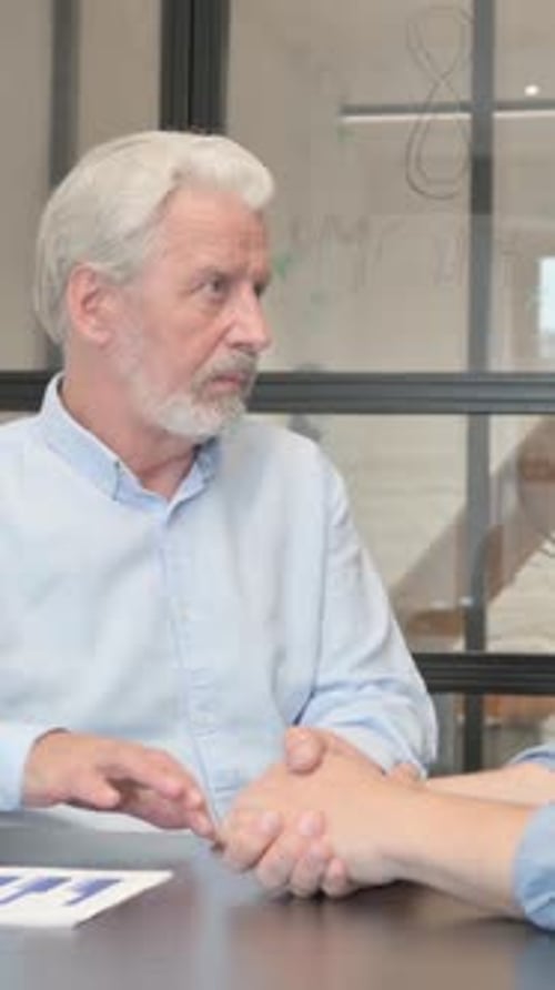 Businessman Talking with Male Worker in Office, vertical video