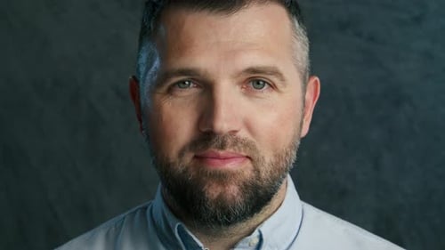 A Detailed CloseUp of a Smiling Man Captured in Stunning Resolution