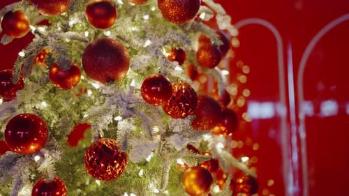 Festive Christmas Tree with Red Ornaments and Lights