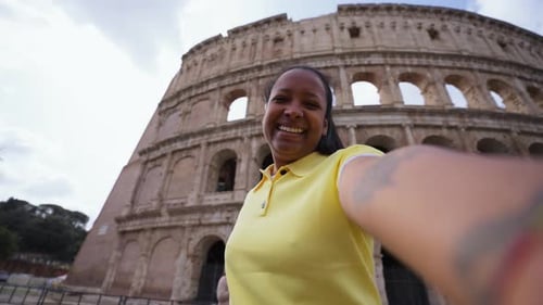 Tourist Taking Selfie Making Victory Sign at Colosseum in Rome Italy