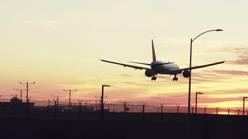Jet airliner landing on runway.