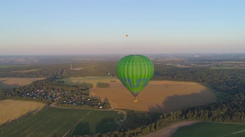 Aerial View of Hot Air Balloons Over Countryside