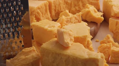 Delicious chunks of orange cheese and grater