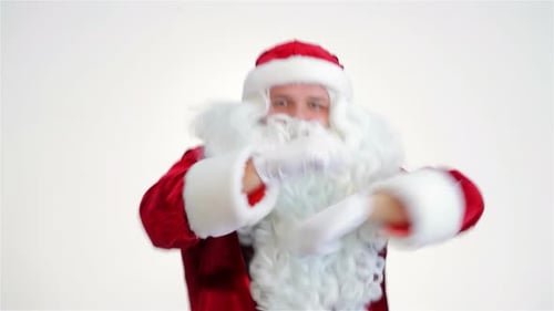 Santa Claus Dances in Front of White Background