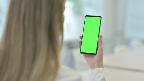 Woman using Smartphone with Green Screen Chroma Key