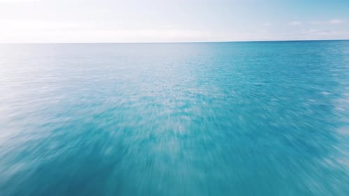Low Altitude Flight Over the Sea Camera Flights Fast Over the Ocean's Surface with Naturally Blurred