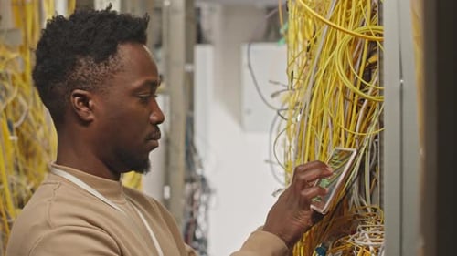IT Professional Checking Server Cables Using a Tablet