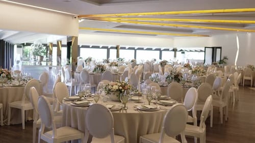 luxury wedding banquet hall with floral table centerpieces