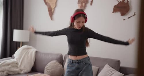 Teenage Girl with Headphones Dancing and Having Fun