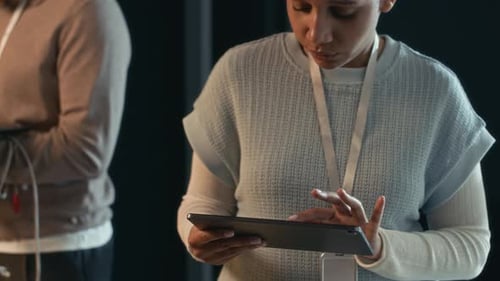IT Specialists Working in Dark Server Room