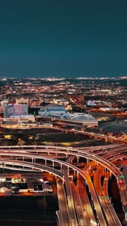 Aerial view of Dallas showcasing city lights and highways at night