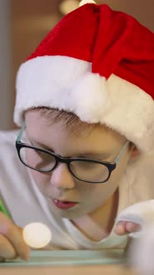 Vertical Video of Focused Child Writing Wish Letter Closeup Portrait