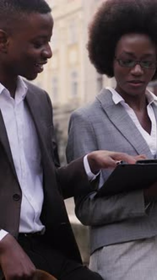 Afro American People Discussing Working Moments on Street