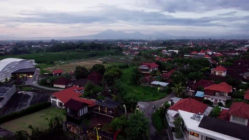 Rice Fields and Villas at Sunset Canggu Bali in Indonesia Aerial Drone View