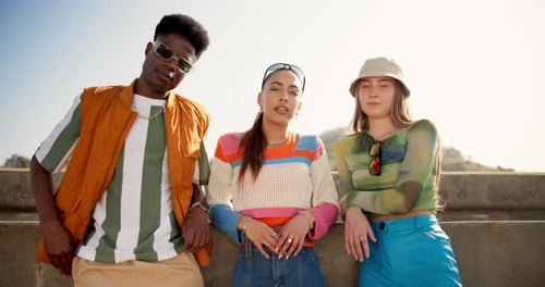 Young Adults Model Fashionable Clothing Outdoors on Sunny Day