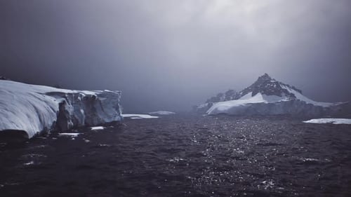 Cinematic Arctic Scene with Dark Ocean and Majestic Icebergs