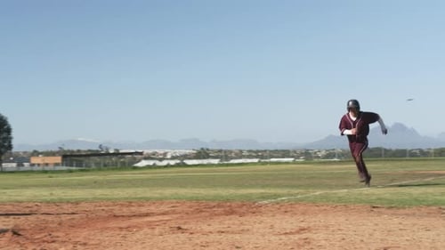 Playing baseball, athlete in uniform standing on base during game