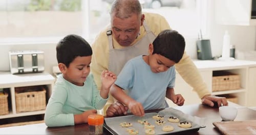 Grandfather Baking Cookies with Children in Bright Kitchen