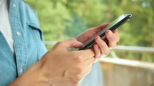 Close Up of Beautiful Caucasian Woman Typing on Phone at Home Health Care Authenticity Sense of