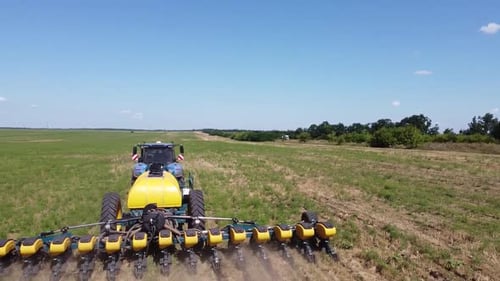 Blue Tractor O.A. Planting Canola On No Till Field