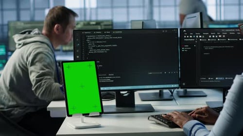 Green Screen Table in Data Center in Front of IT Support Specialists