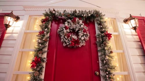 Festive Holiday Decorations on a Red Door