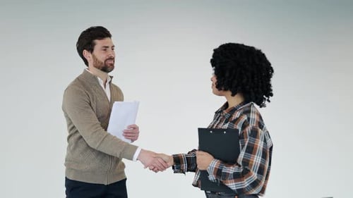Business Partners Shaking Hands After Successful Agreement in Modern Office