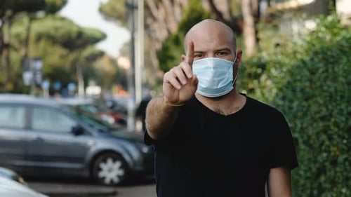 keep your distance - man wearing the mask prevents the camera from getting close