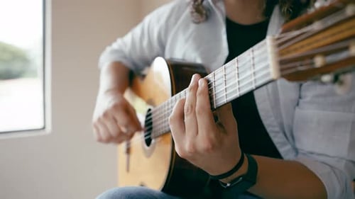 Male Musician Playing Classical Acoustic Guitar