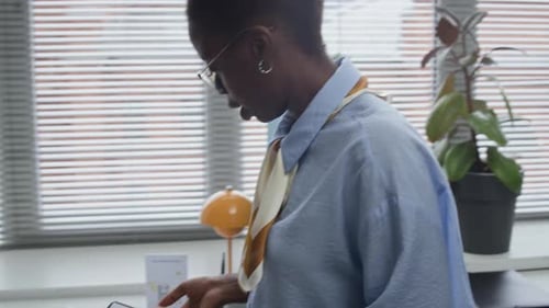 Bank Consultant Talking to Male Client Checking Agreement in Office