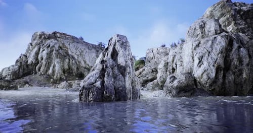 Rocky Ocean Shoreline with Clear Water and Blue Sky