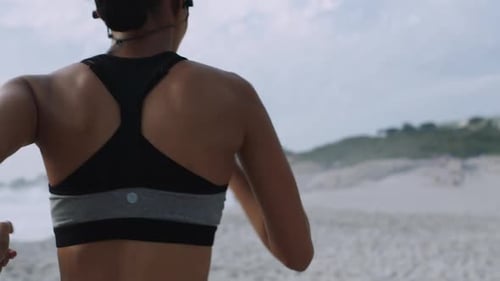 Fitness, motivation and woman running on beach for marathon training, endurance workout