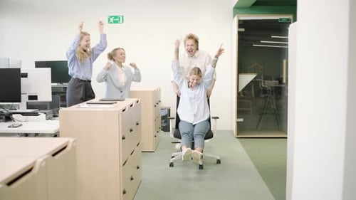Office Fun with Team Collaboration Chair Racing for Bonding and Motivation Among Coworkers