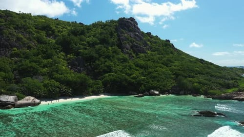 Drone flying over a beautiful beach on La Digue Island in the Seychelles, Africa.