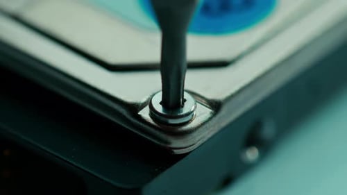 Screw Unscrewed from Computer Hard Drive Close Up