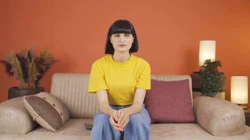 Woman Sitting on Couch, Mid Shot Portrait