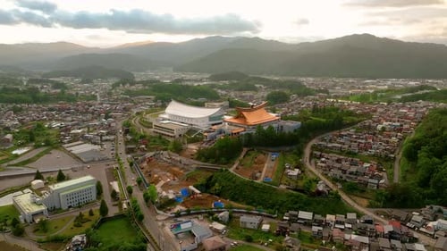 Aerial view of buildings and mountains, Japan.