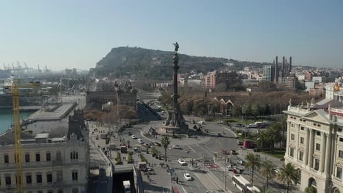 Cars Driving on Road Around Columbus Monument