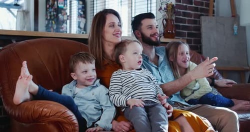 Happy Family Relaxing Together on Couch