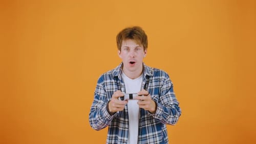 Excited Young Adult Playing a Video Game