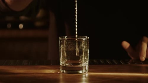 Bartender is Chilling a Glass